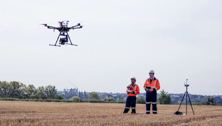 Image of men inspecting drone infrastructure