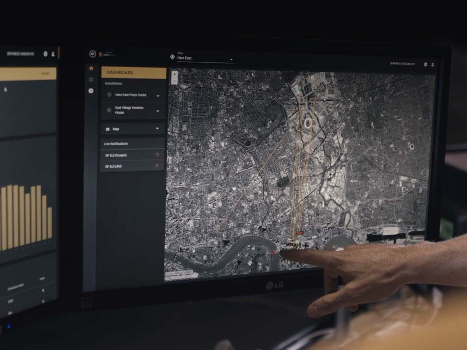 Someone pointing at a map on a computer screen