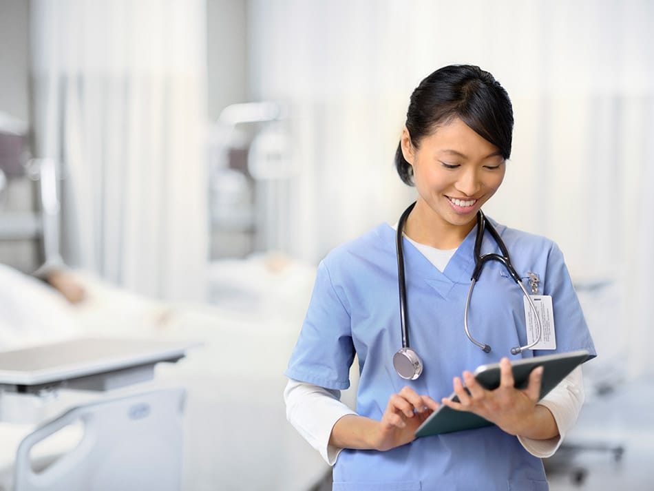 Nurse looking at tablet device