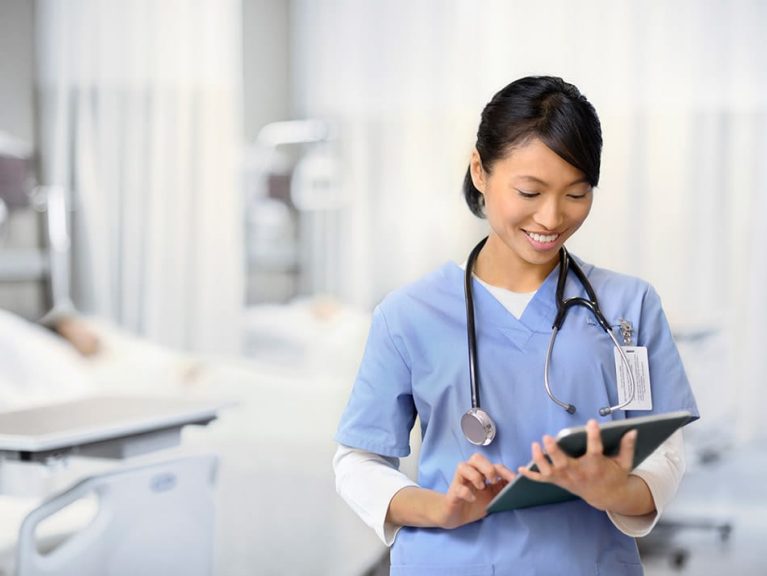 Health professional holding a tablet device
