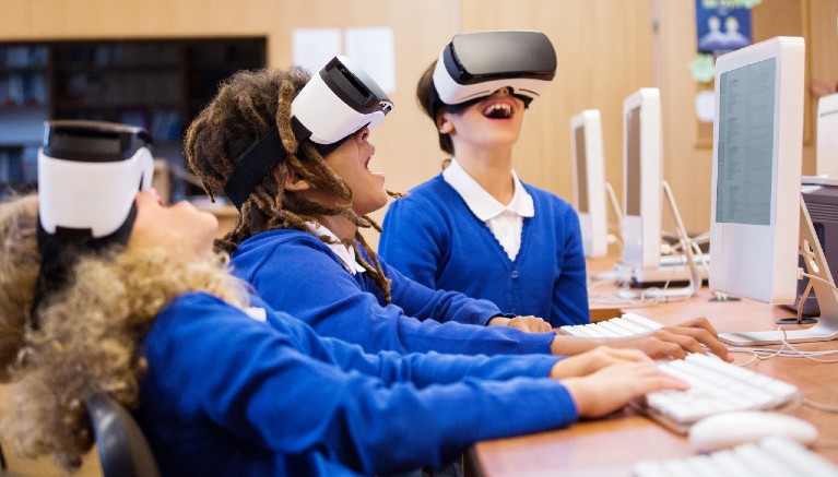 School children wearing VR glasses