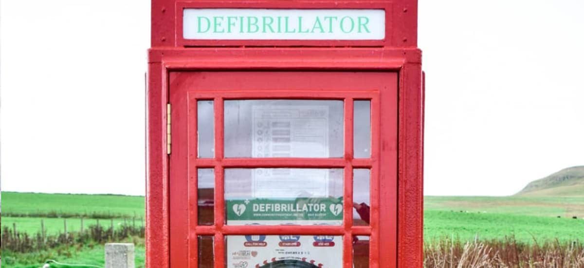 Red phone box with defibrilator inside