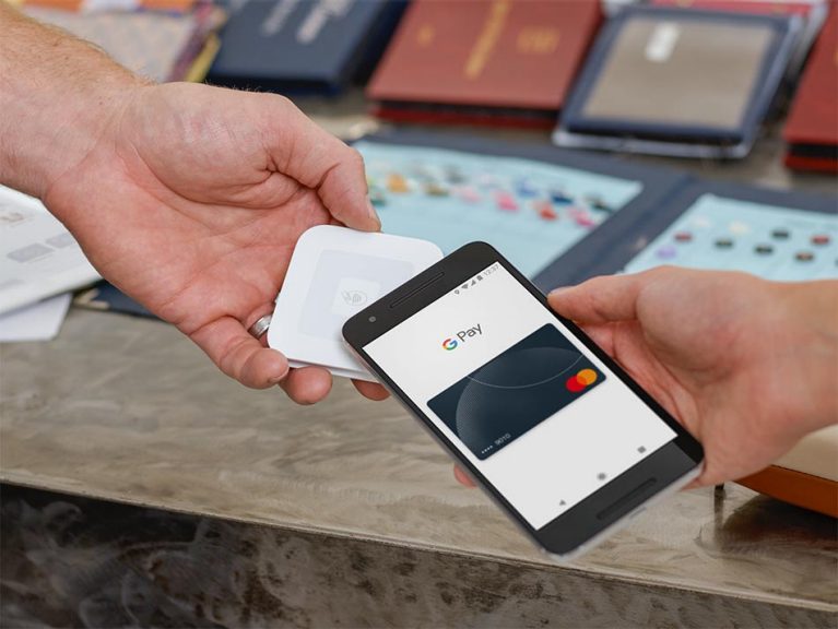 A customer using Google Pay to make a payment over the Square contactless card reader